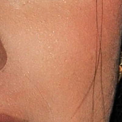 Cardi B's skin tone — warm golden-tawny at a medium-to-deep depth