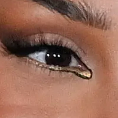 Doja Cat's eyes — dark warm brown with dramatic liner