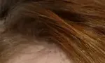 Emma Stone's hair — warm strawberry-golden, luminous Spring signature