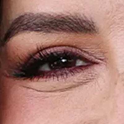 Eva Longoria's eyes — warm deep brown, Deep Autumn quality