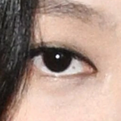 Jennie's eyes — near-black with cool depth