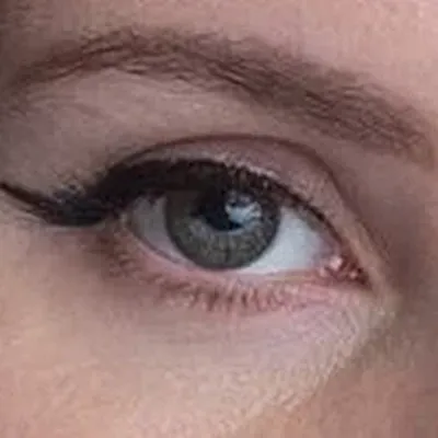 Lana Del Rey's eyes — muted hazel, warm and quiet, Soft Autumn quality