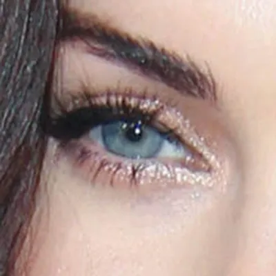 Megan Fox's eyes — electric vivid blue-green, Bright Winter signature