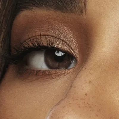 Shay Mitchell's eyes — deep warm brown, Deep Autumn quality