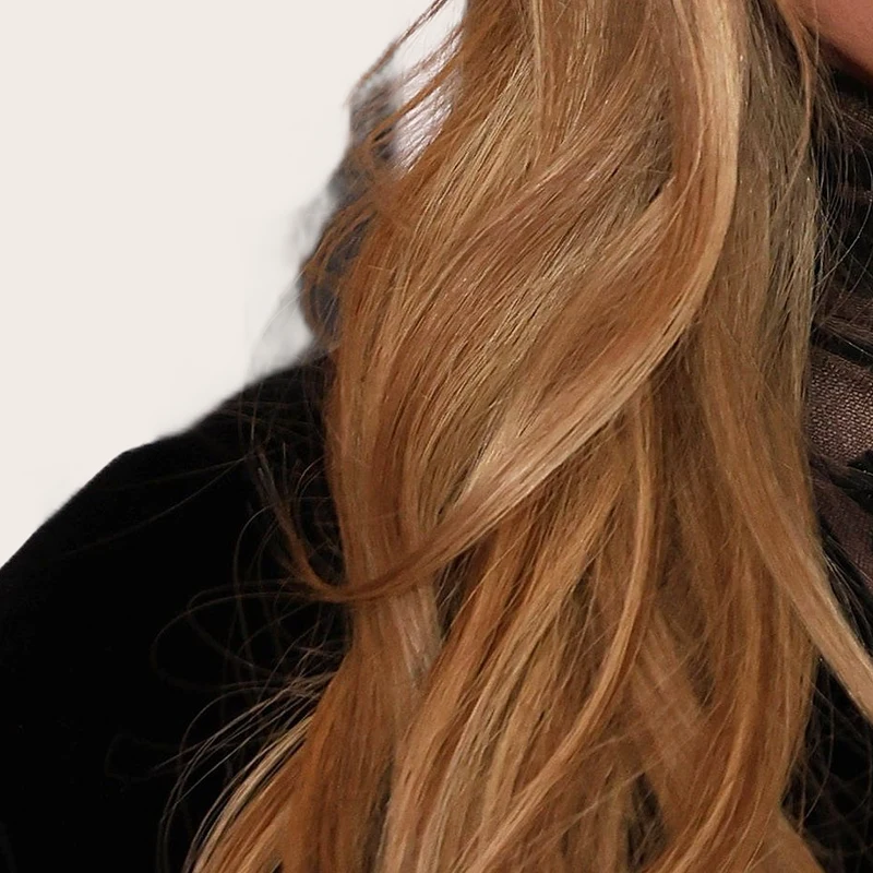Sydney Sweeney's hair — warm golden blonde with caramel and honey highlights
